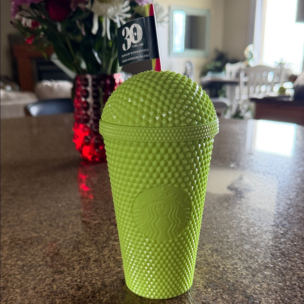 This is a limited edition Starbucks 30th Anniversary Neon Green Studded Tumble